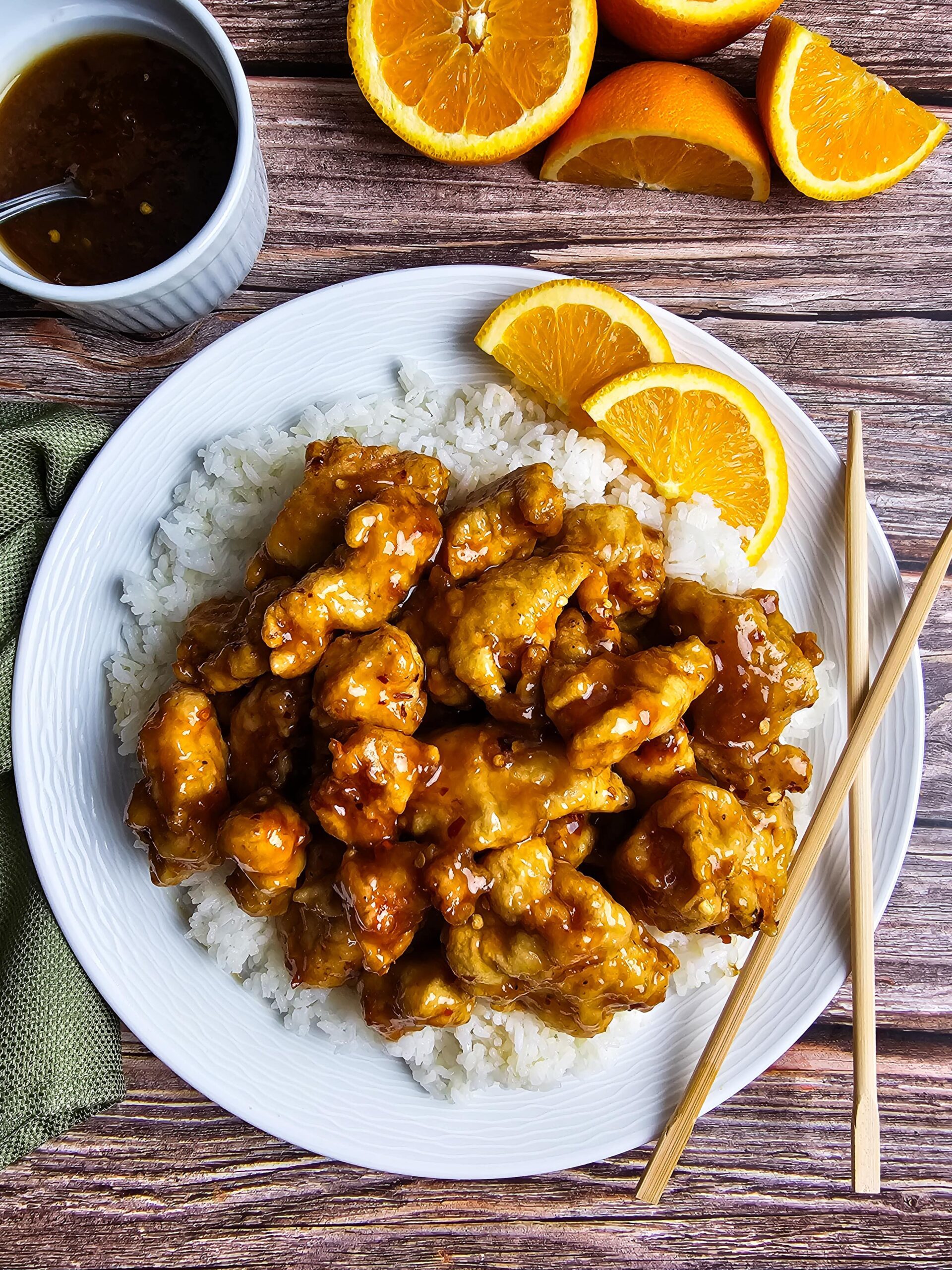 PLATED ORANGE CHICKEN ON A BED OF WHITE RICE