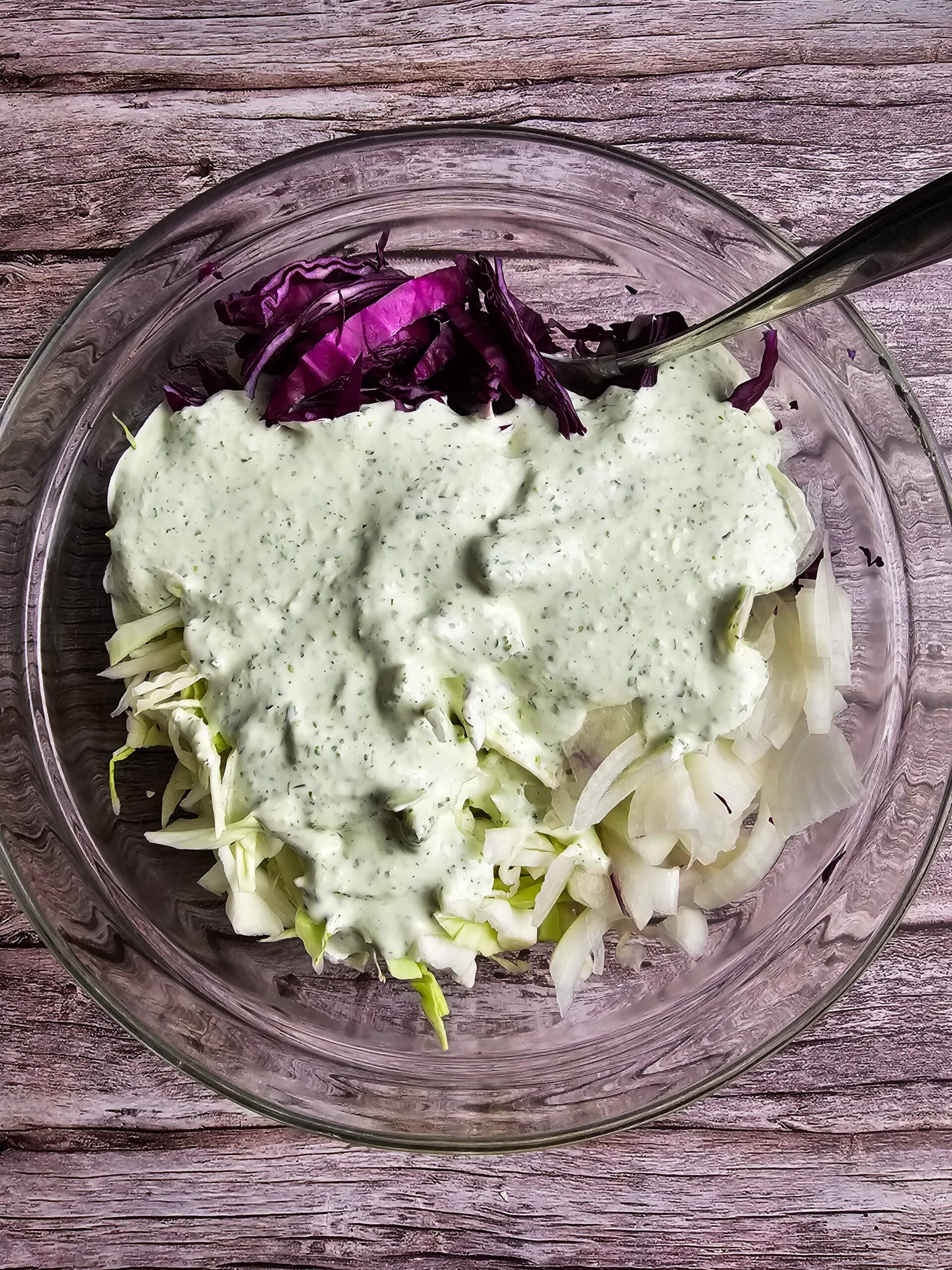COMBINE THE CABBAGE AND THE DRESSING IN A LARGE BOWL