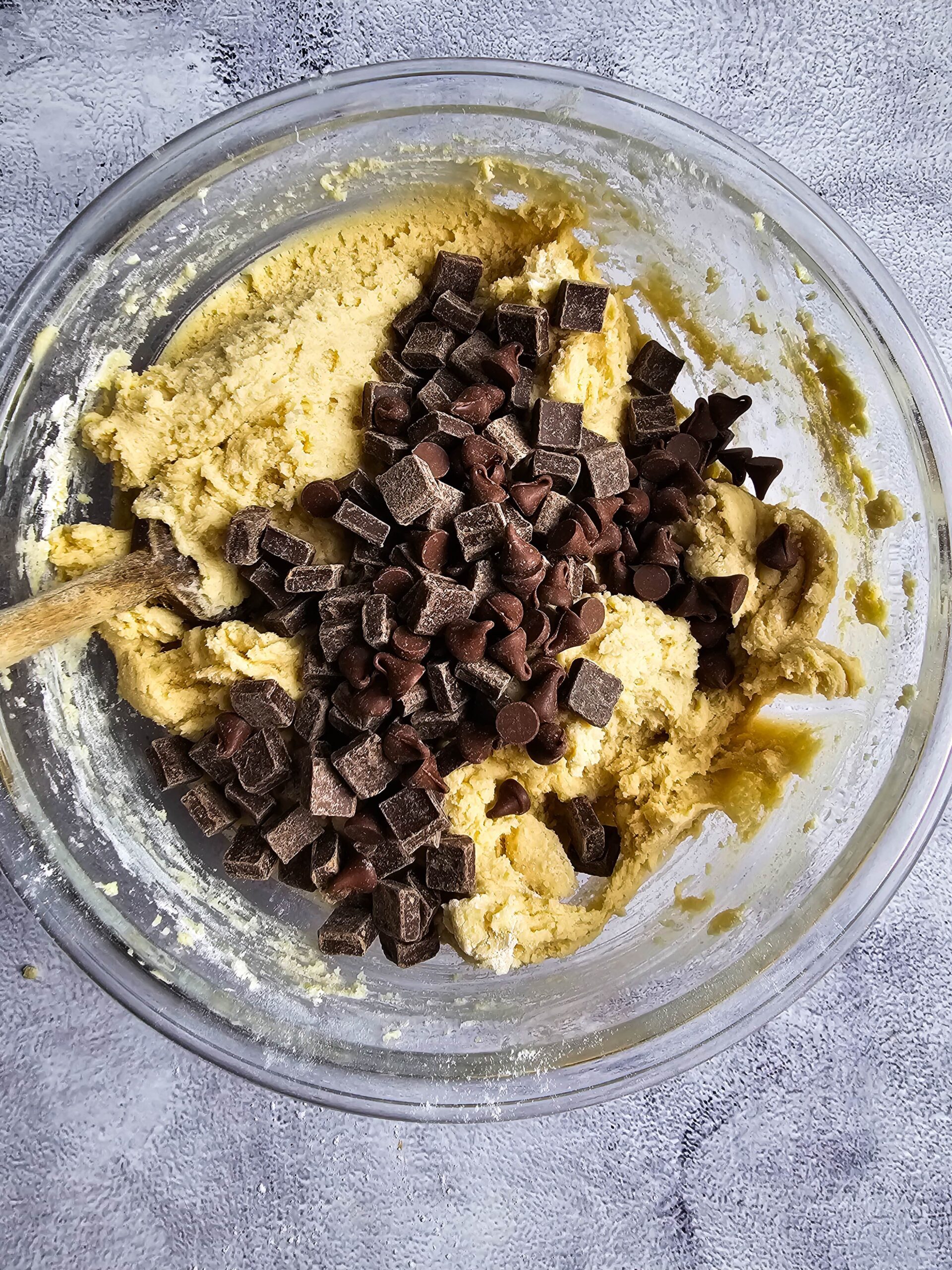 ADDING CHOCOLATE CHIPS TO THE GLASS BOWL