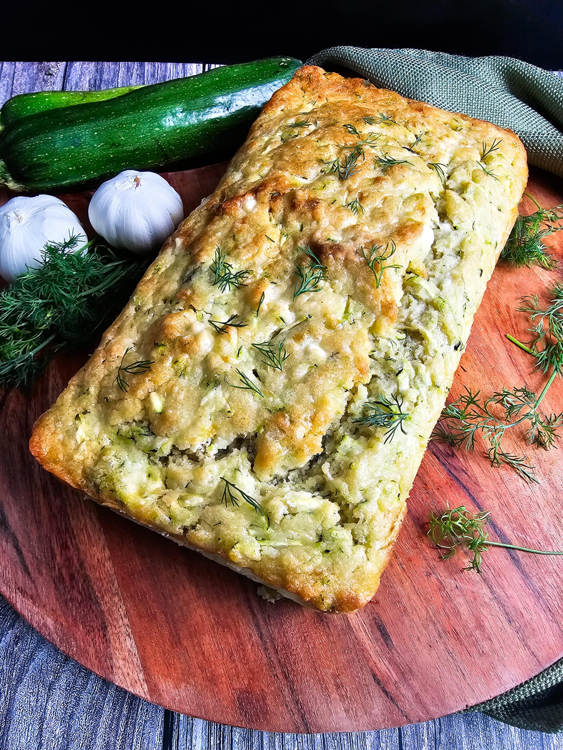 REMOVED BAKED LOAF FROM PAN AND PHOTOGRAPHED ON WOODEN CUTTING BOARD