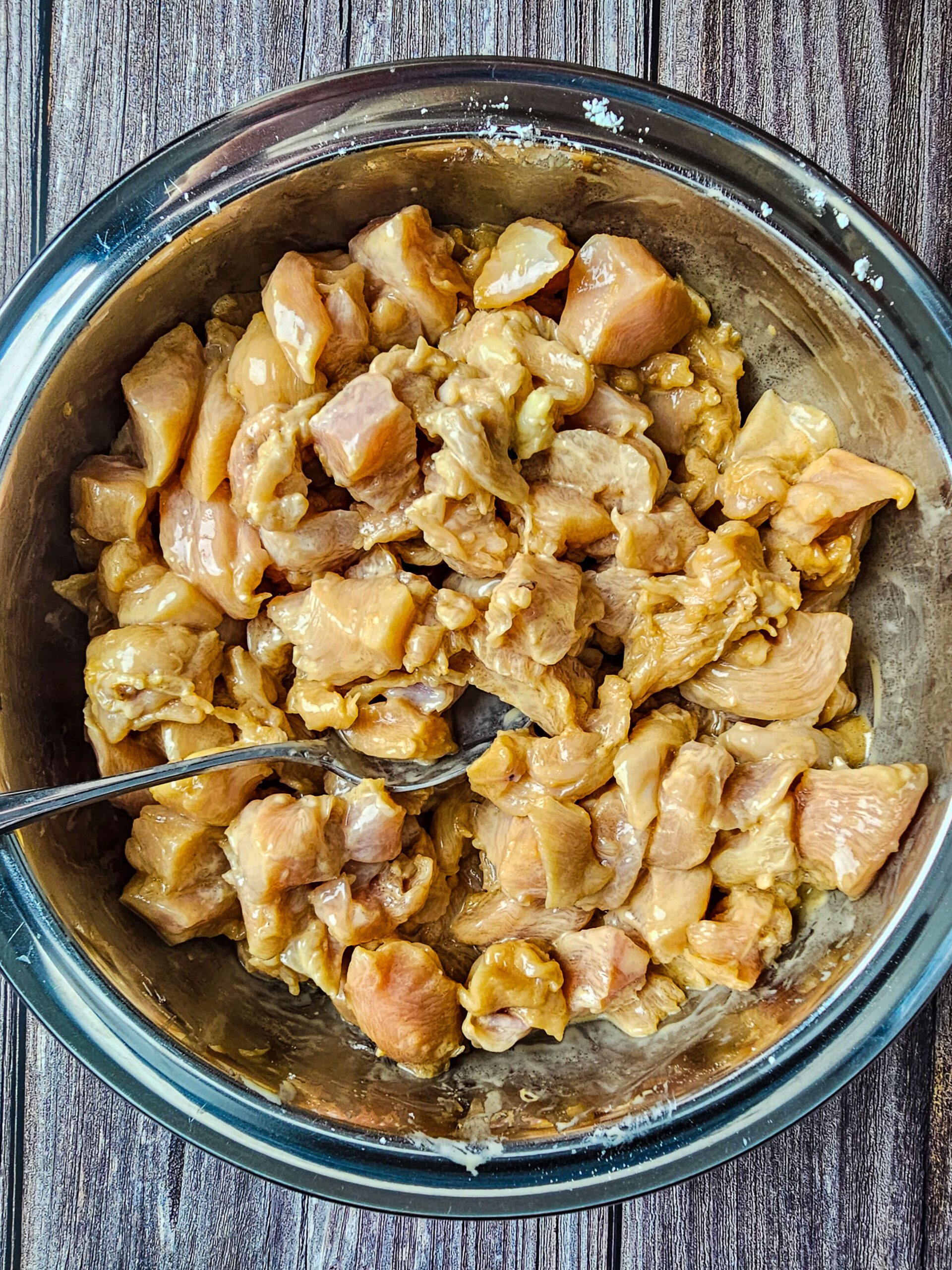 ALL MARINADE INGREDIENTS TO THE DICED CHICKEN BREAST IN A STAINLESS STEAL BOWL
