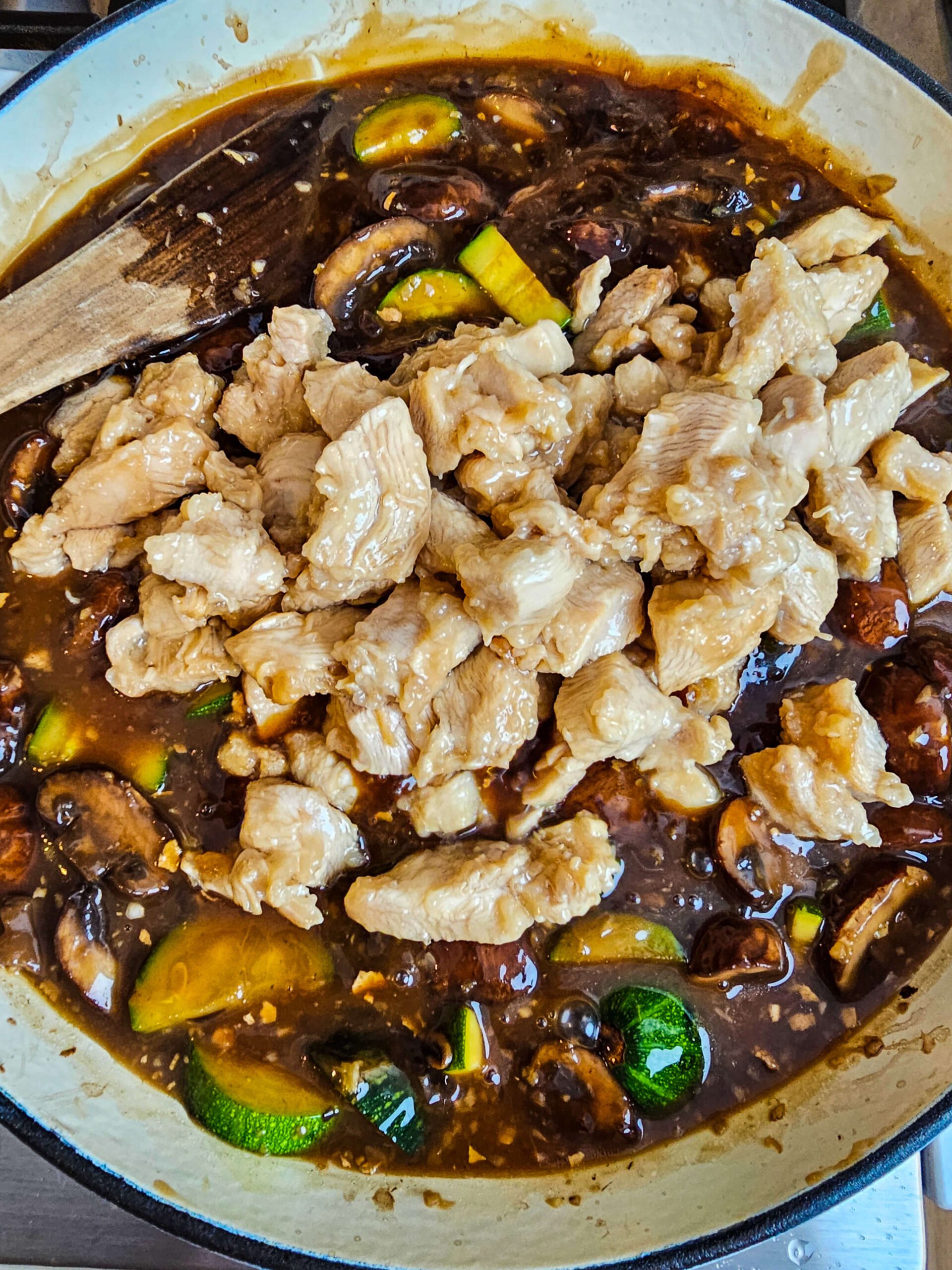 ADD THE SAUCE AND THE CHICKEN TO THE SKILLET AND BRING IT TO A SIMMER UNTIL THE SAUCE THICKENS