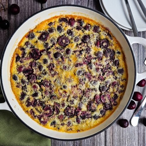 BAKED CHERRY DESSERT SERVED ON WOODEN TABLE
