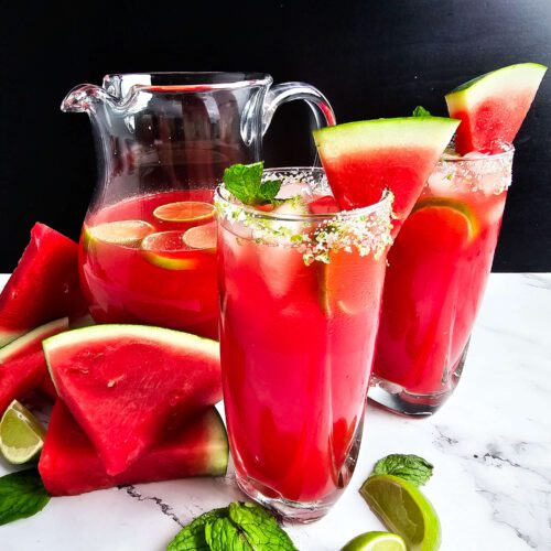 LARGE PITCHER WITH TWO TALL GLASSES FULL OF WATERMELON LIMEADE