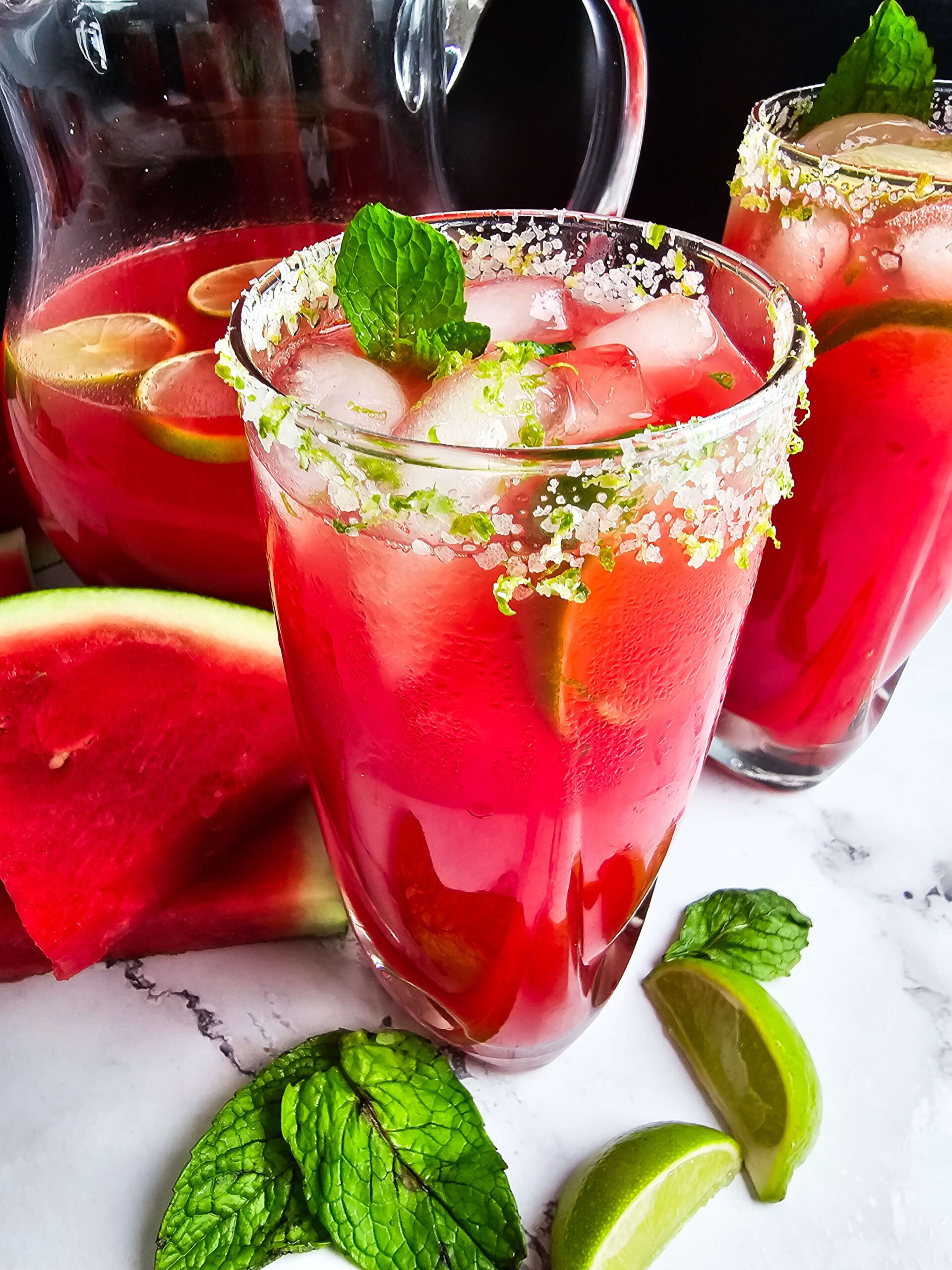 GARNISH WITH MINT AND FRESH LIMES AND SERVE IN TALL GLASS