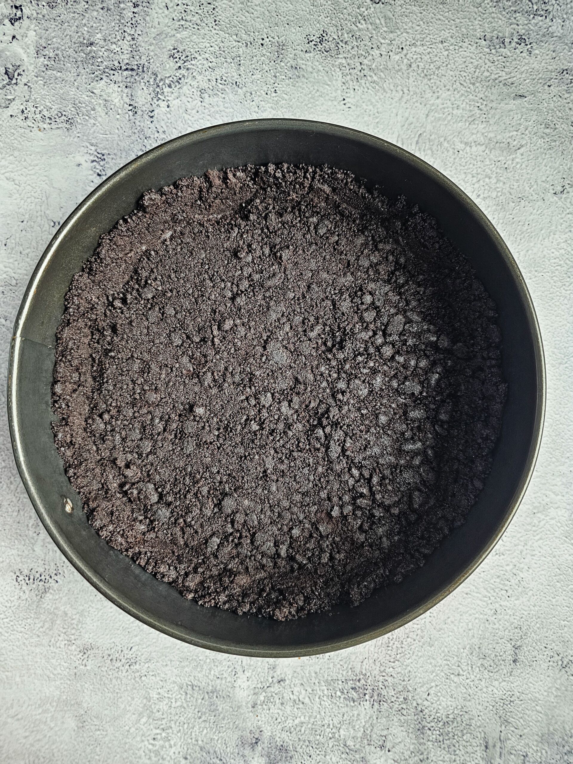 OREO COOKIE CRUST PRESSED INTO A 9 INCH SPRINGFORM PAN