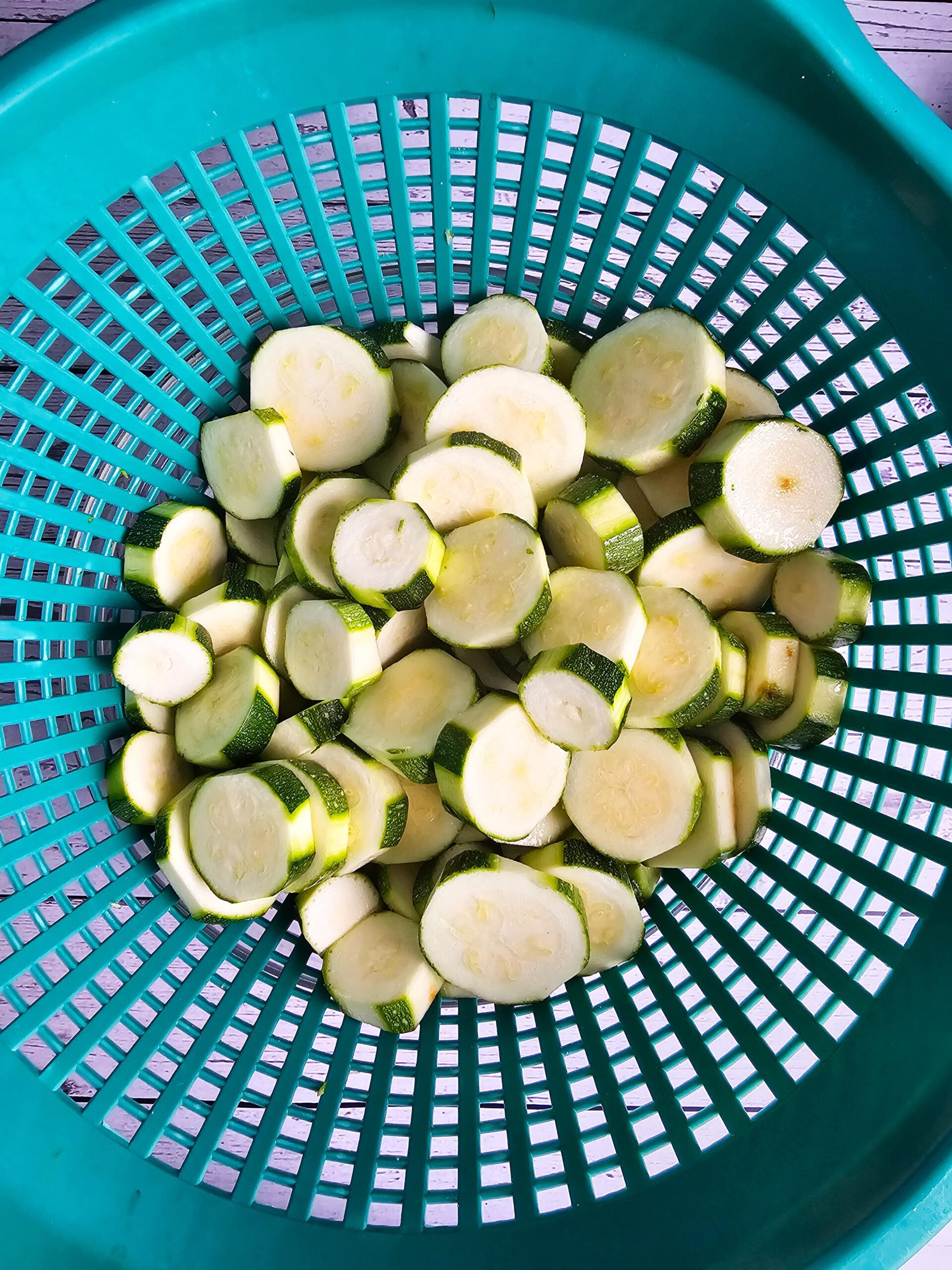 PHOTO OF ZUCCHINI DRAINING IN COLLANDER