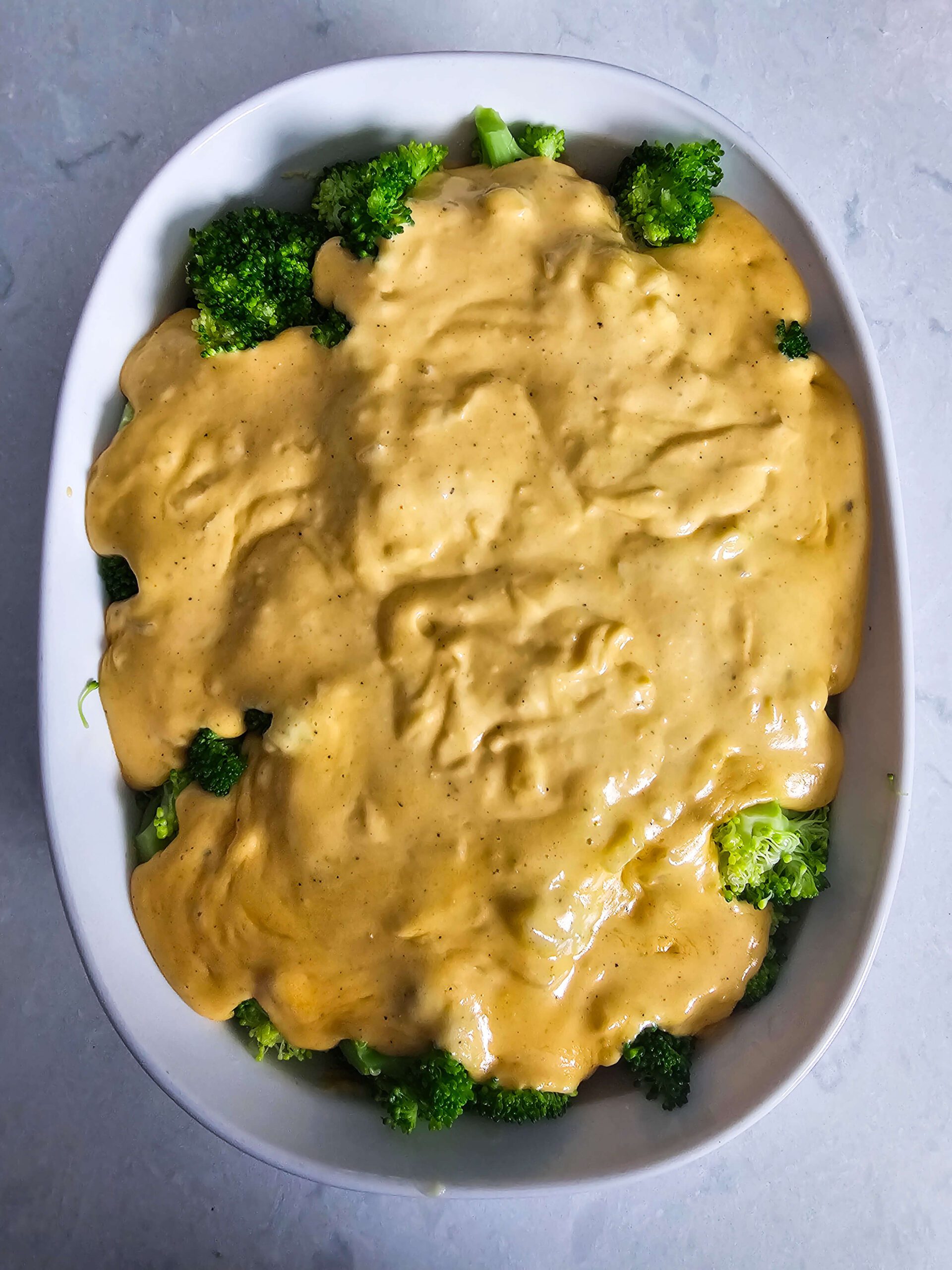 ADD THE CHEESE SAUCE TO THE BROCCOLI AND TOSS