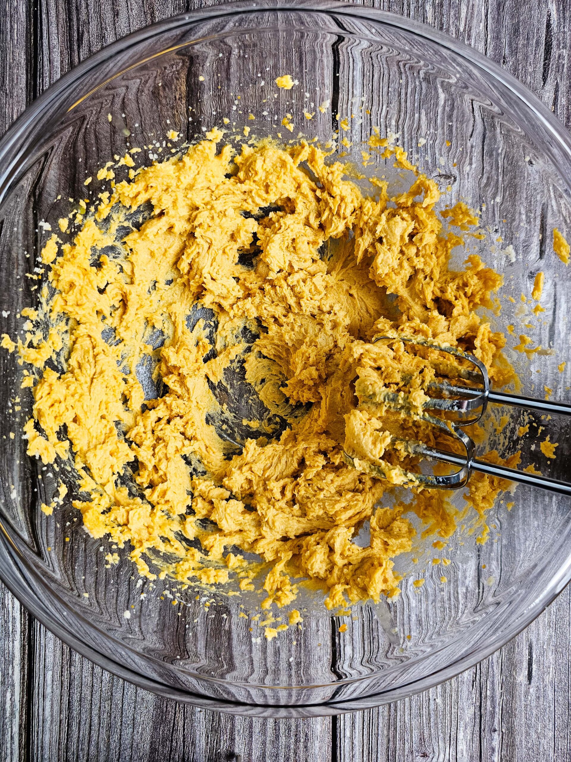 CREAM THE BUTTER AND SUGAR FOR TWO MINUTES IN A LARGE CLEAR GLASS BOWL