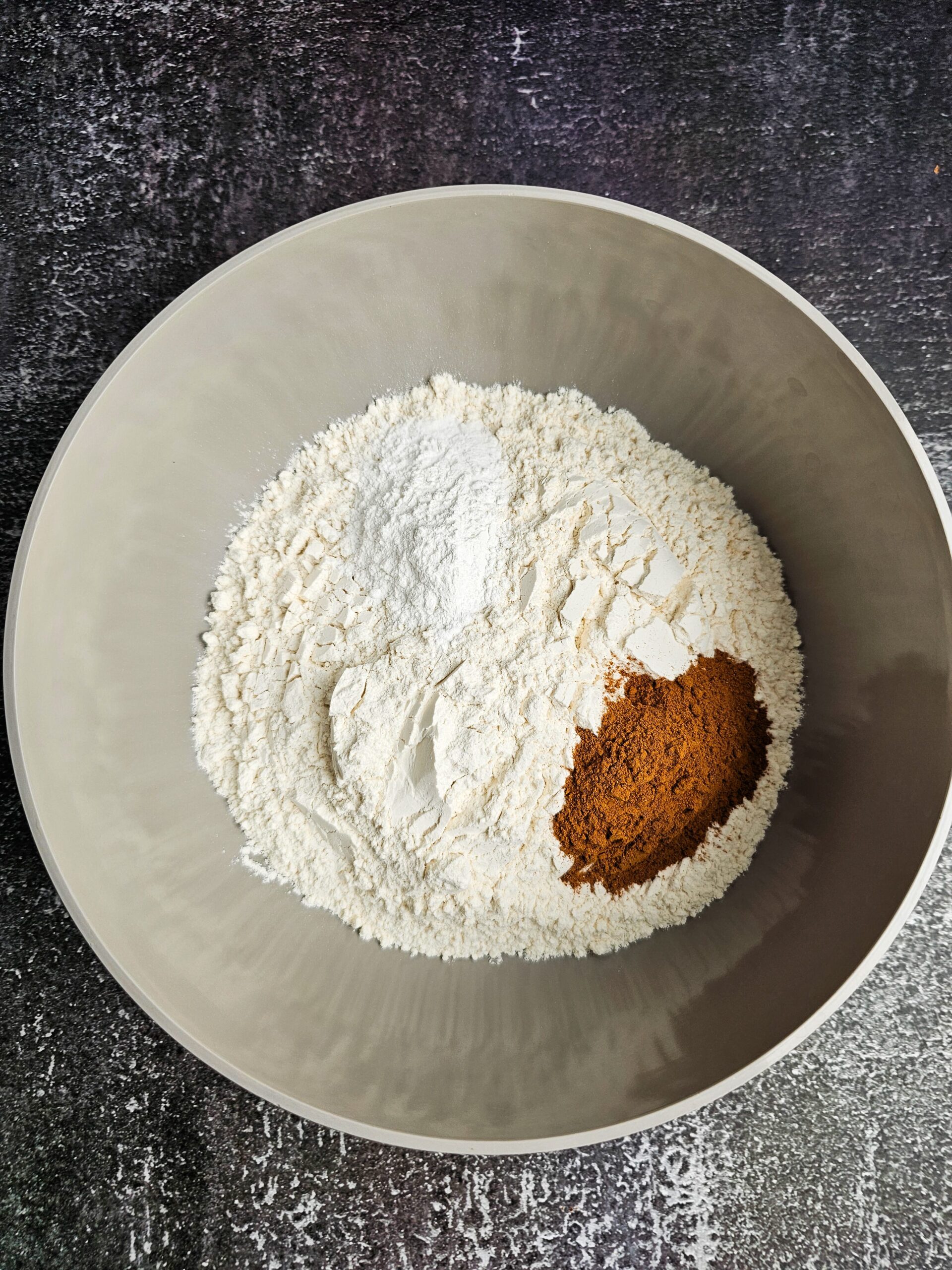 GRAY BOWL WITH ALL THE DRY INGREDIENTS COMBINED