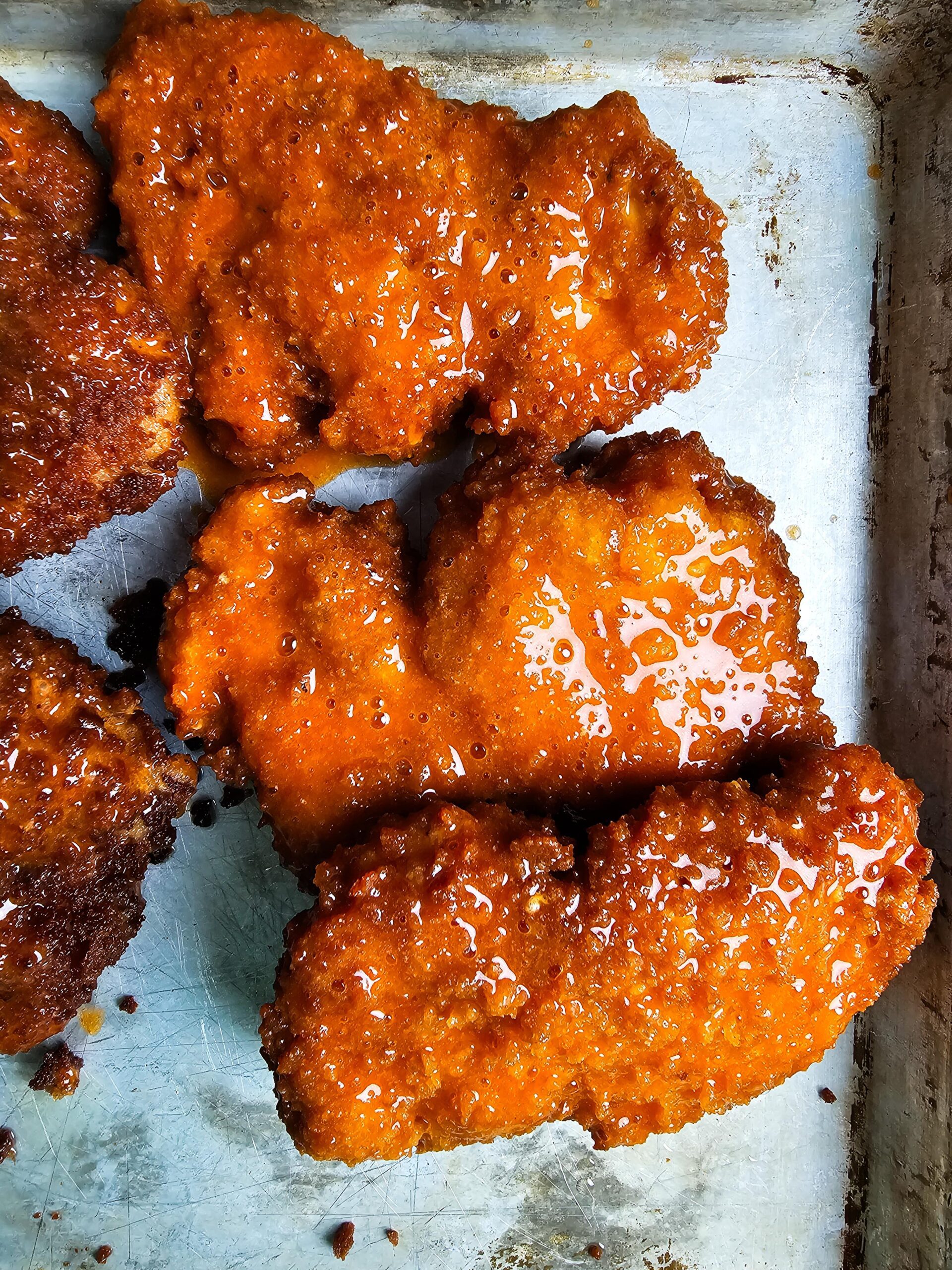 DIPPED FRIED CHICKEN INTO THE BUFFALO SAUCE AND ASSEMBLE THE SANDWICHES