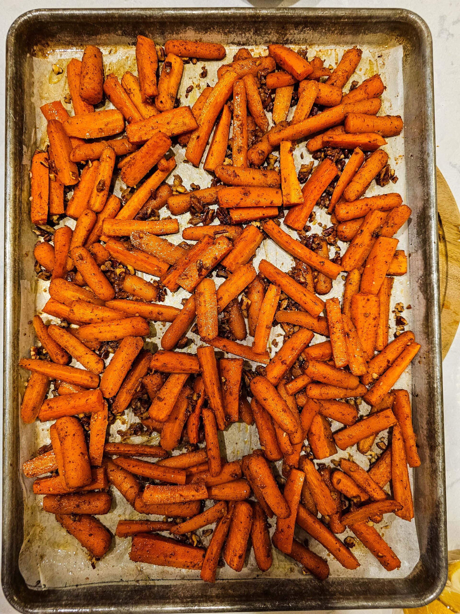 add the pecans and toss the carrots and return to the oven