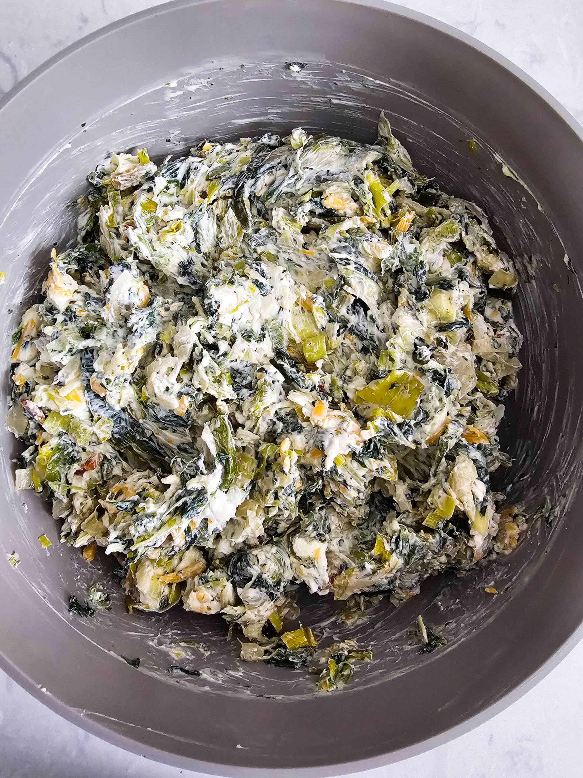 COMBINE THE SAUTE VEGETABLES AND CHEESES TOGETHER