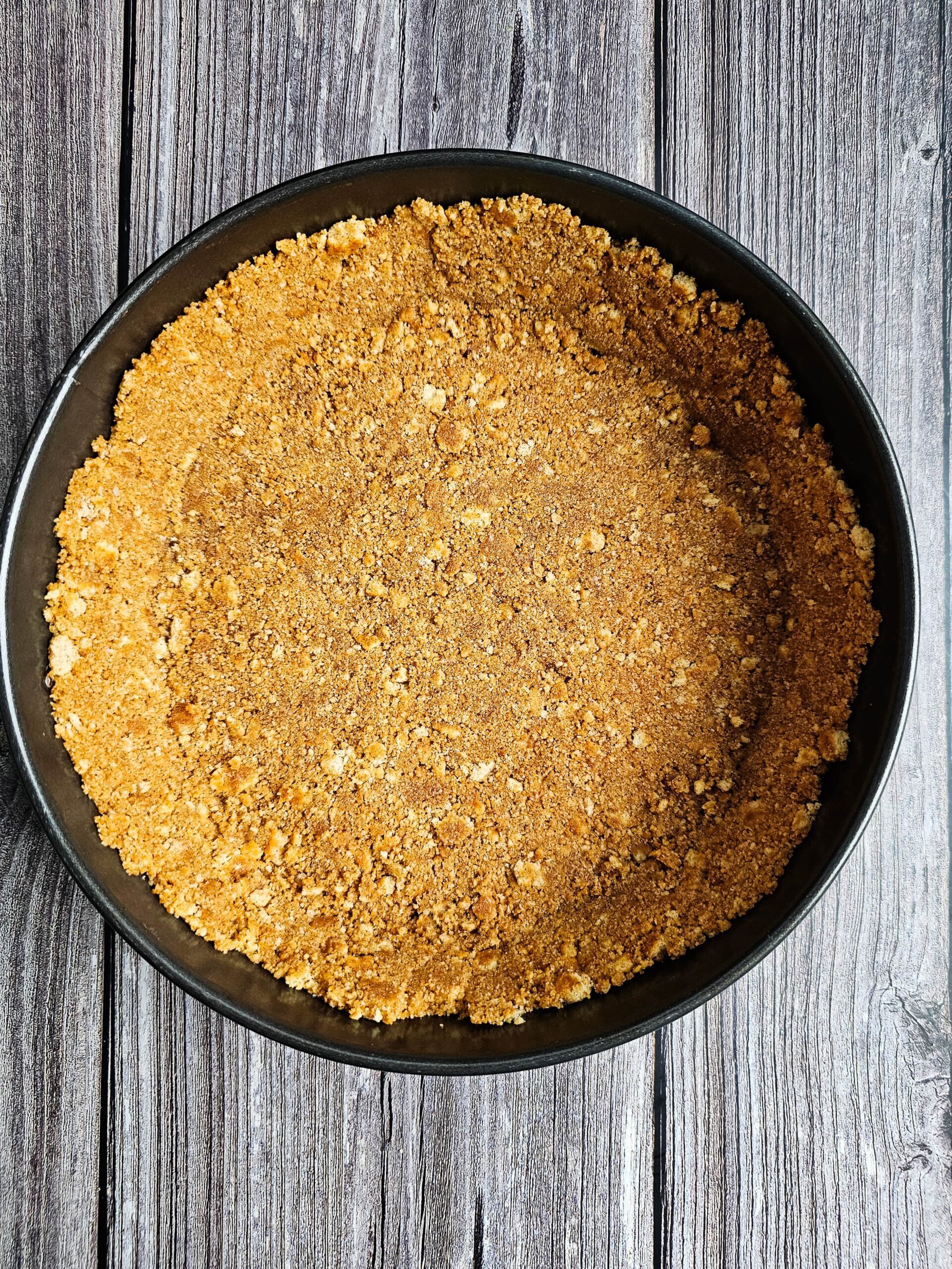 graham cracker cheesecake crust pressed into a 9 inch round springform pan