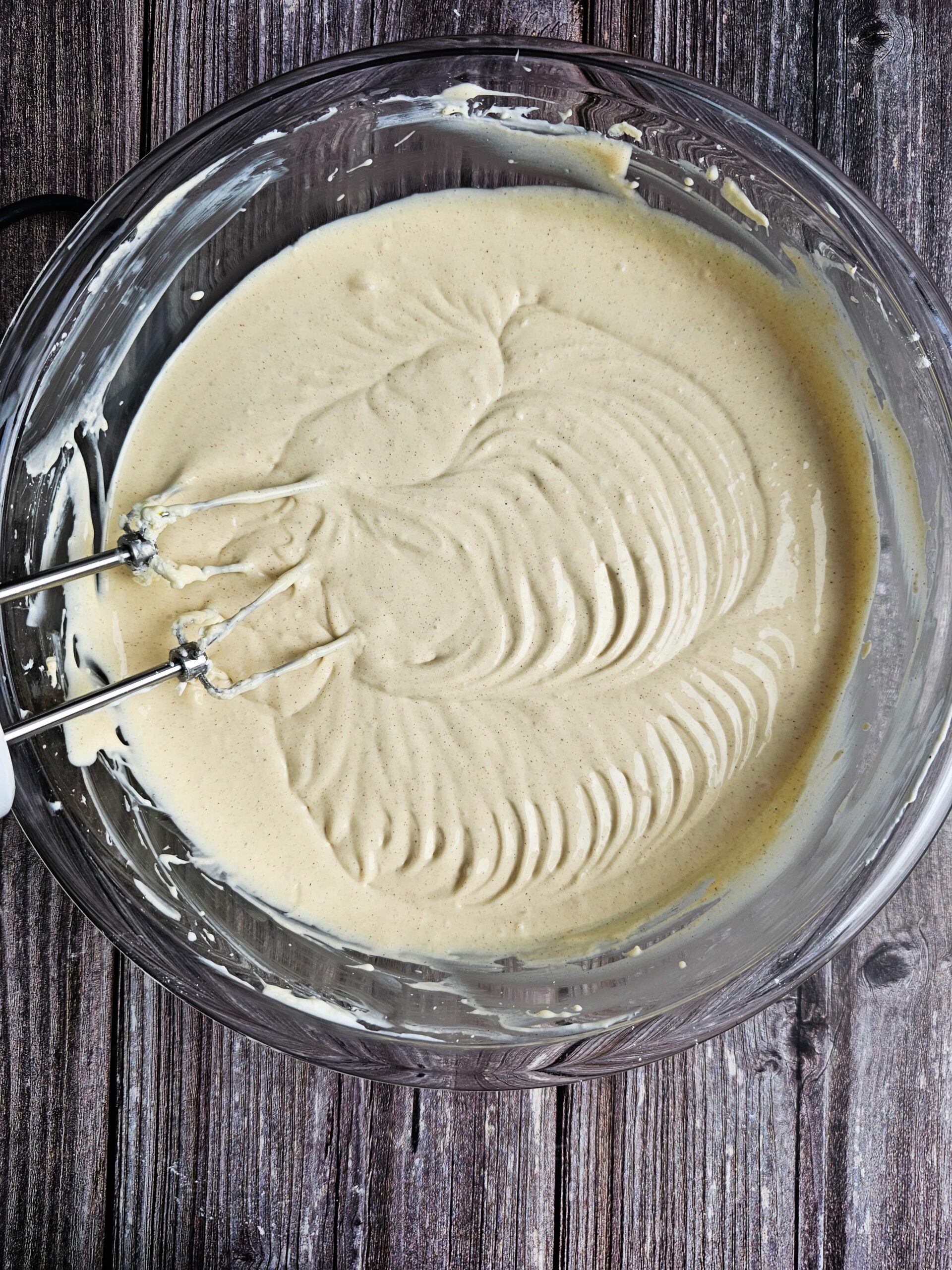 large bowl with the cheesecake filling prepared