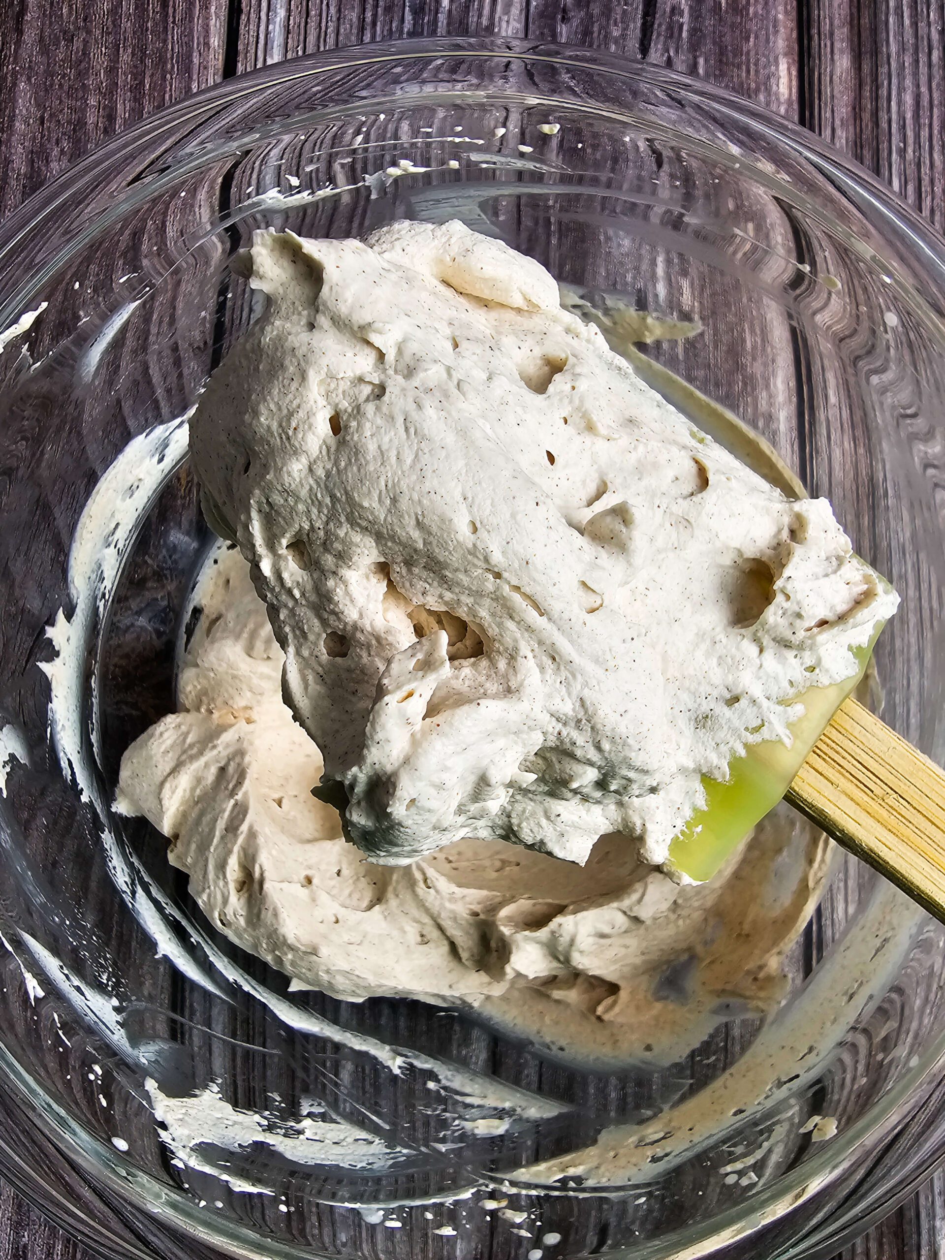 cinnamon flavored whipped topping up close on a spoon