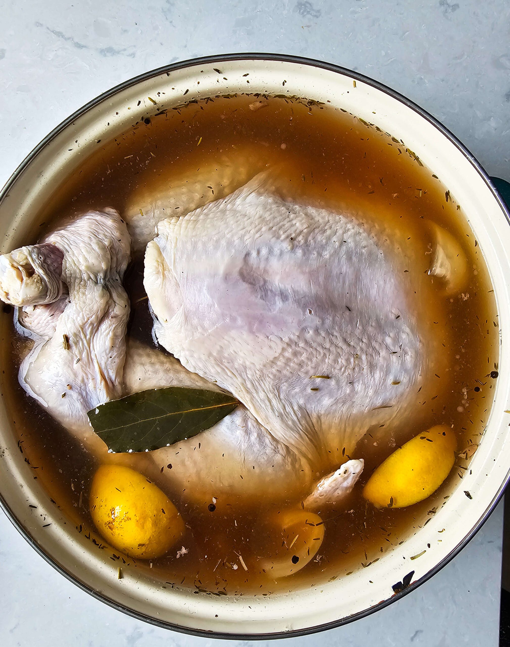 SUBMERGE THE TURKEY INTO THE STOCKPOT TO BRINE IN THE REFRIGERATOR 18-24 HOURS