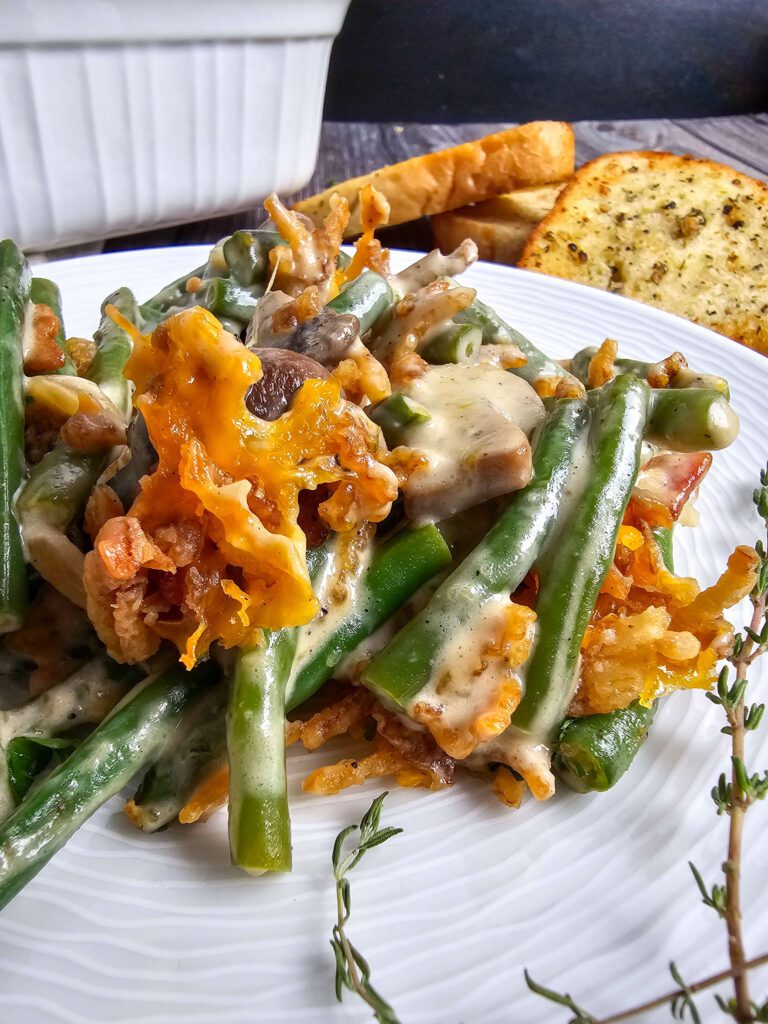 UP CLOSE PICTURE OF GREEN BEAN CASSEROLE SERVED ON A PLATE