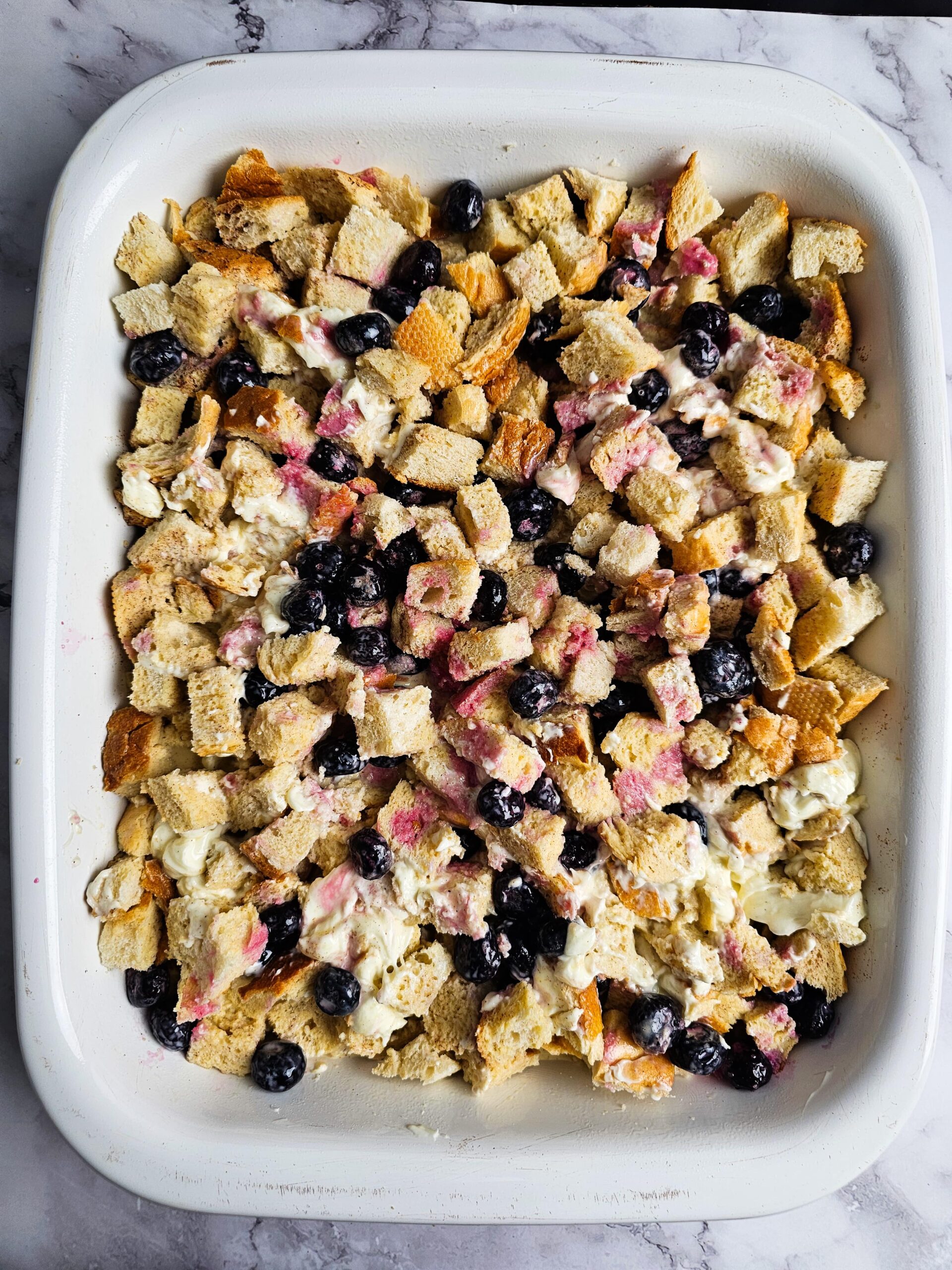 POUR THE CUSTARD OVER THE BREAD LAYERS AND SOAK OVER NIGHT