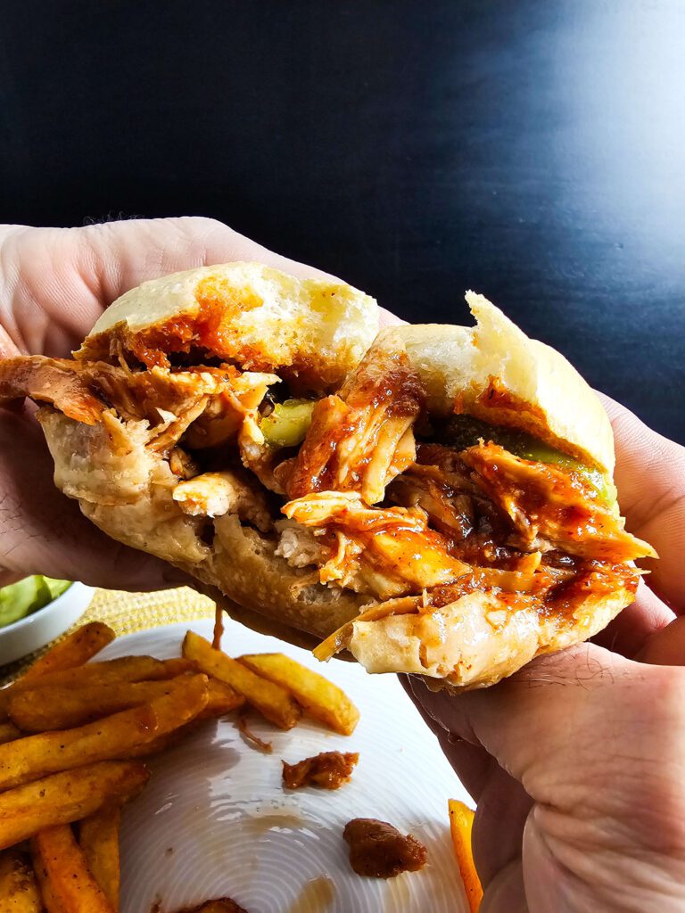 LARGE BITES TAKED FROM THE SANDWICH TO SHOW INTERNAL TEXTURE