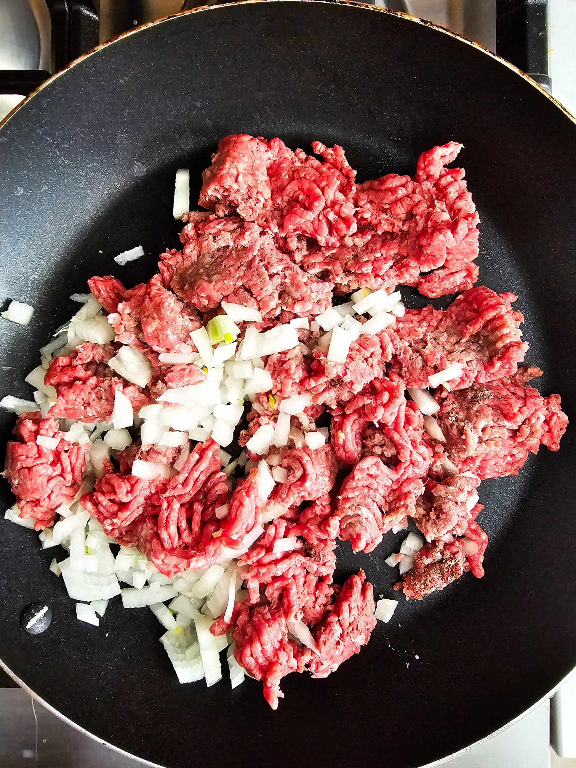 BROWN THE BEEF AND ONIONS AND DRAIN ALL THE EXCESS THE FAT