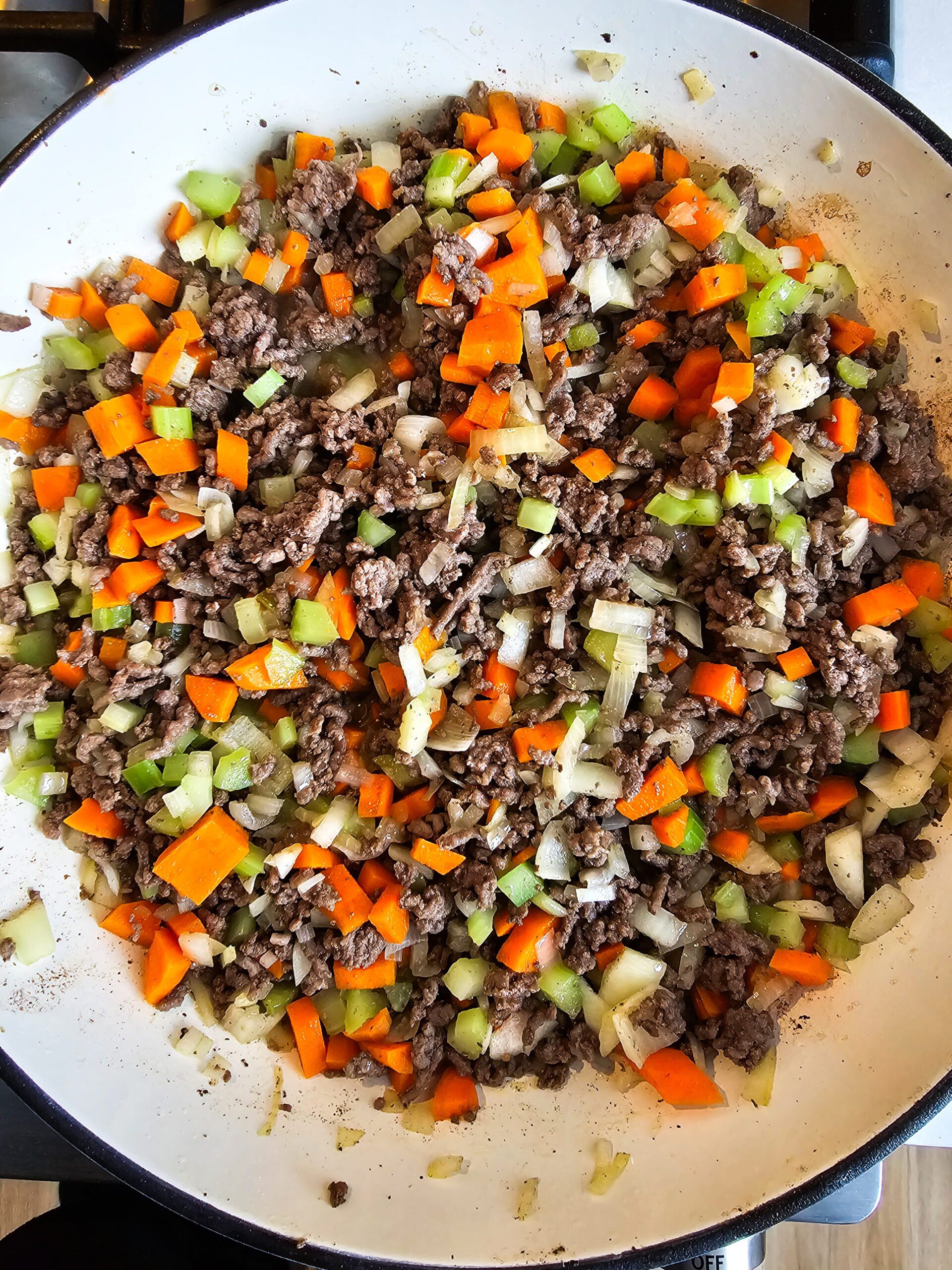 BROWN THE GROUND BEEF AND ADD THE VEGETABLES