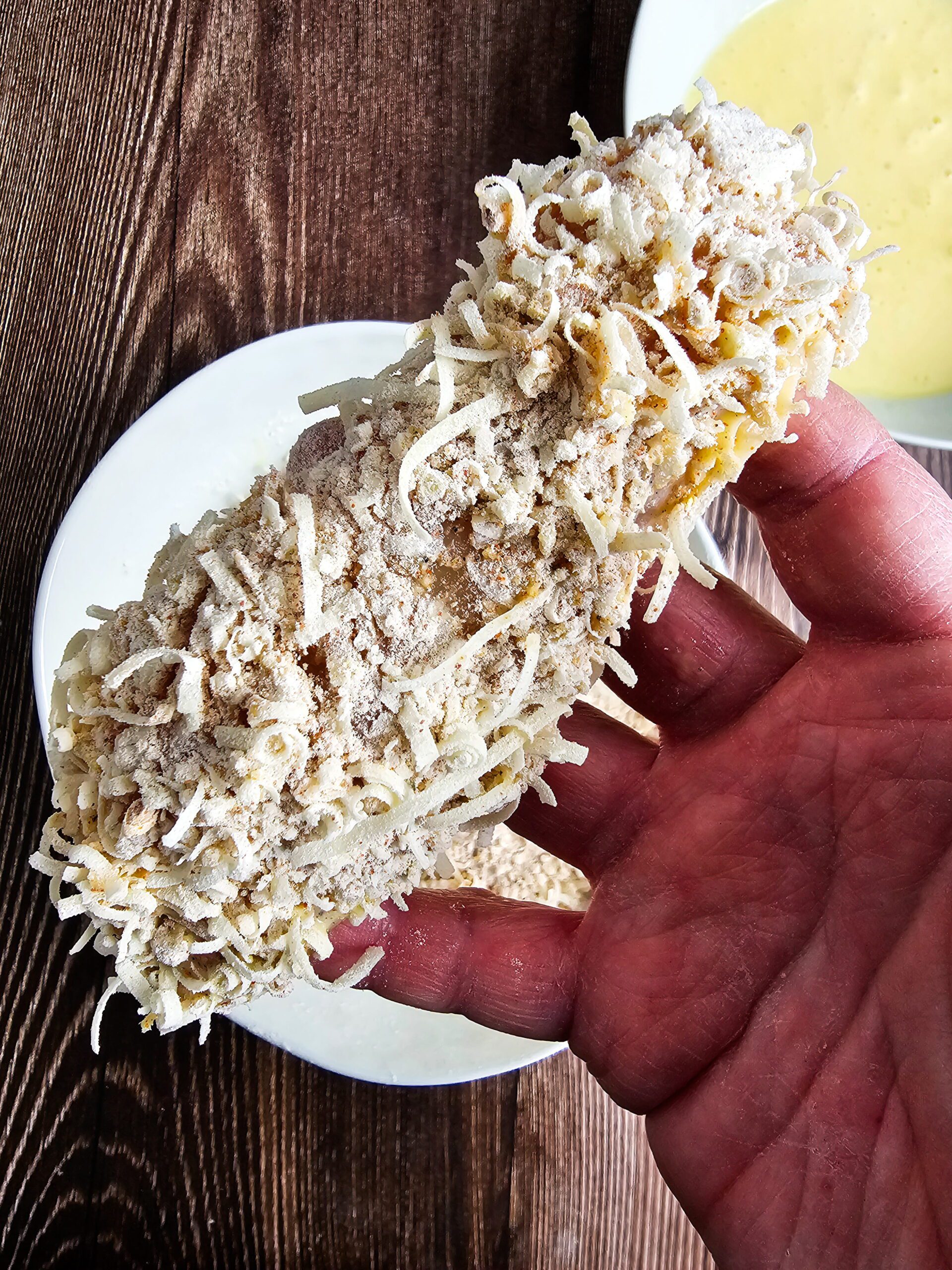 PRESS THE COMBINED MIXTURE INTO THE CHICKEN TENDERS