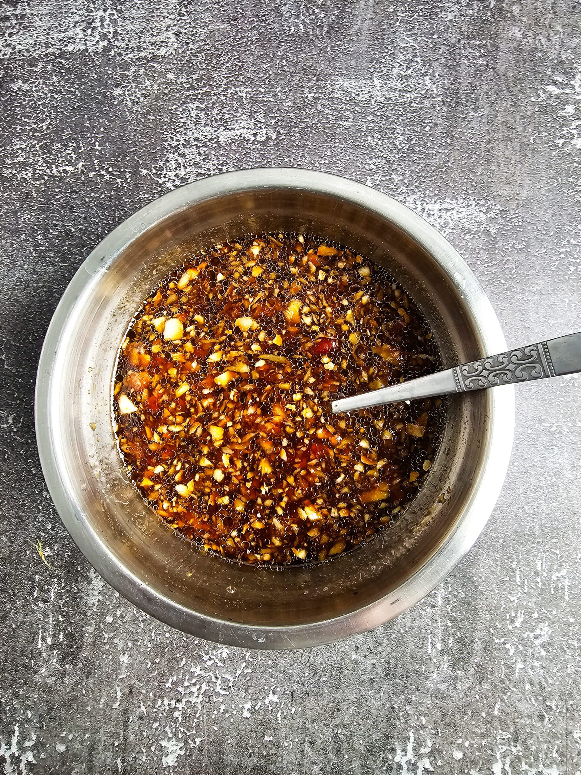 huli huli chicken marinade being whisked in a bowl