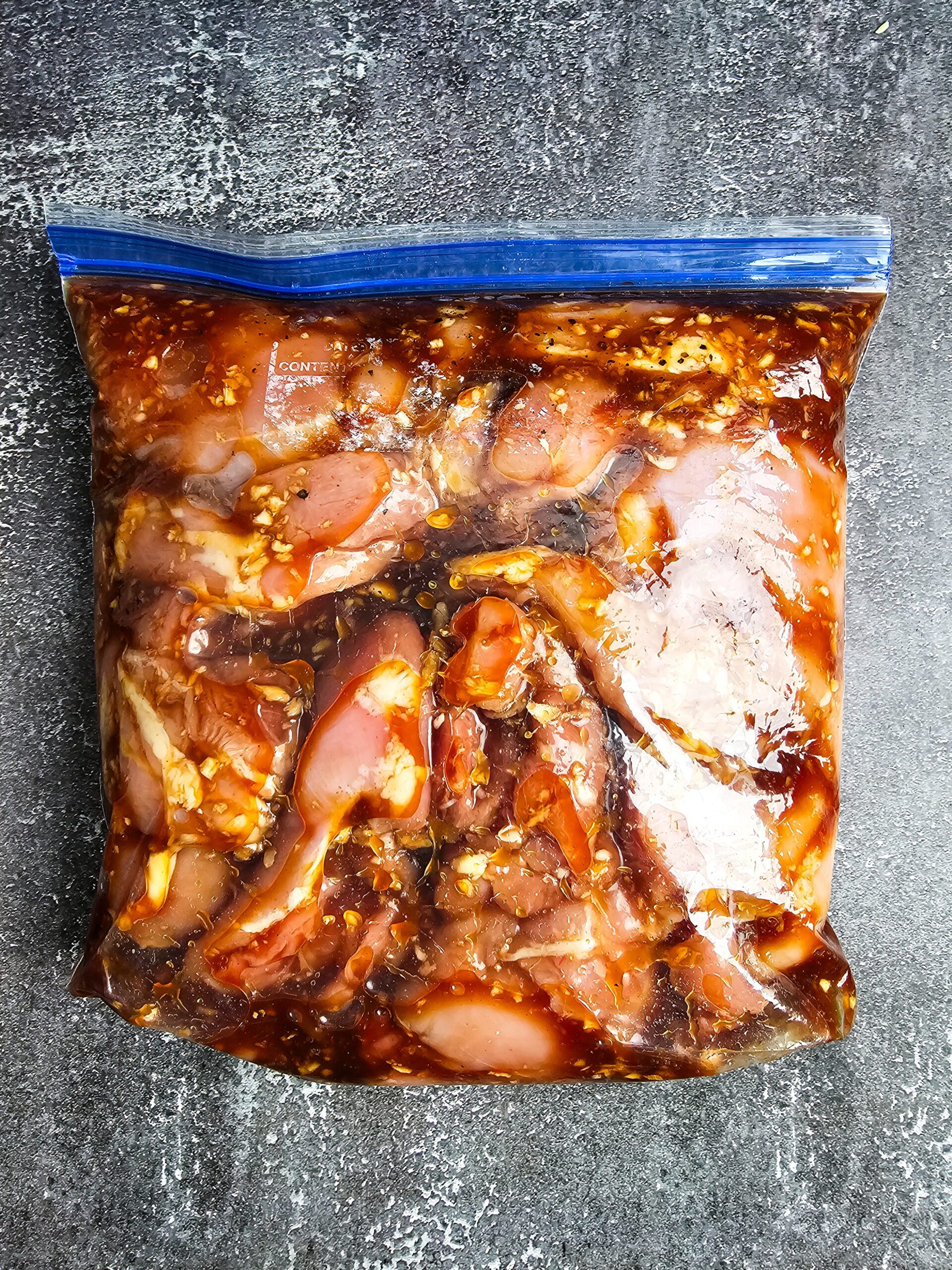 chicken thighs marinating in huli huli sauce