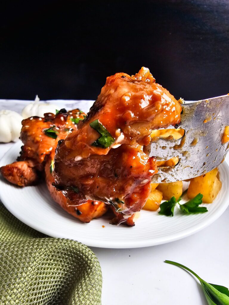 huli huli chicken recipe close up on a fork