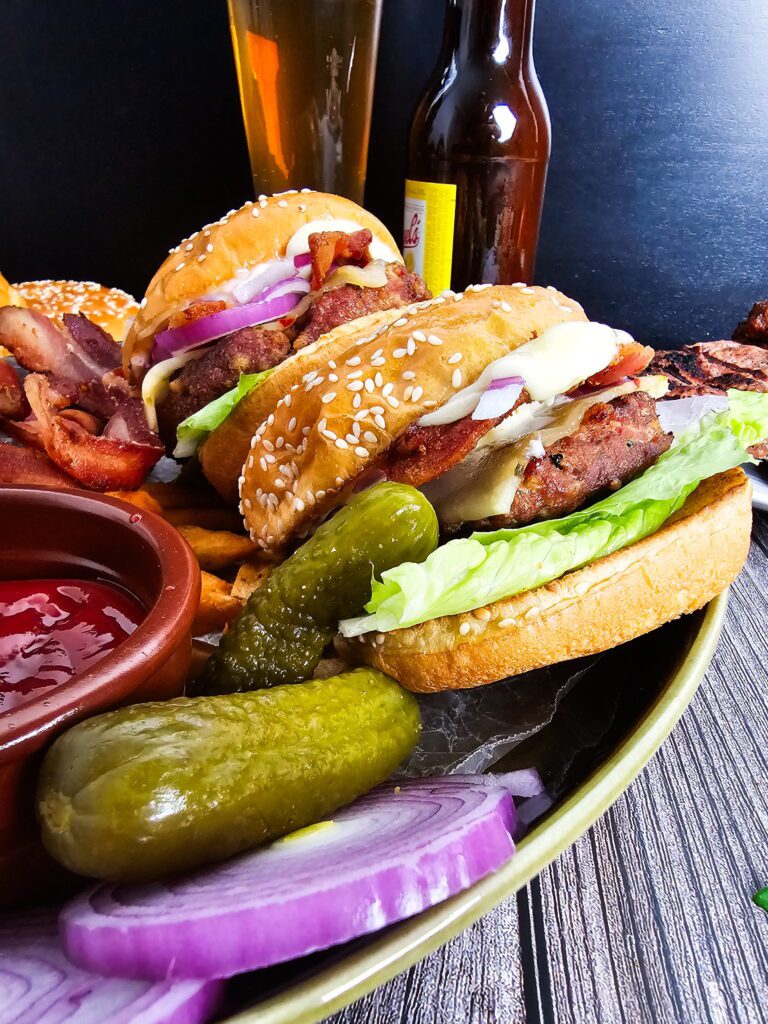 Juicy turkey burger on a toasted brioche bun with lettuce, tomato and red onion