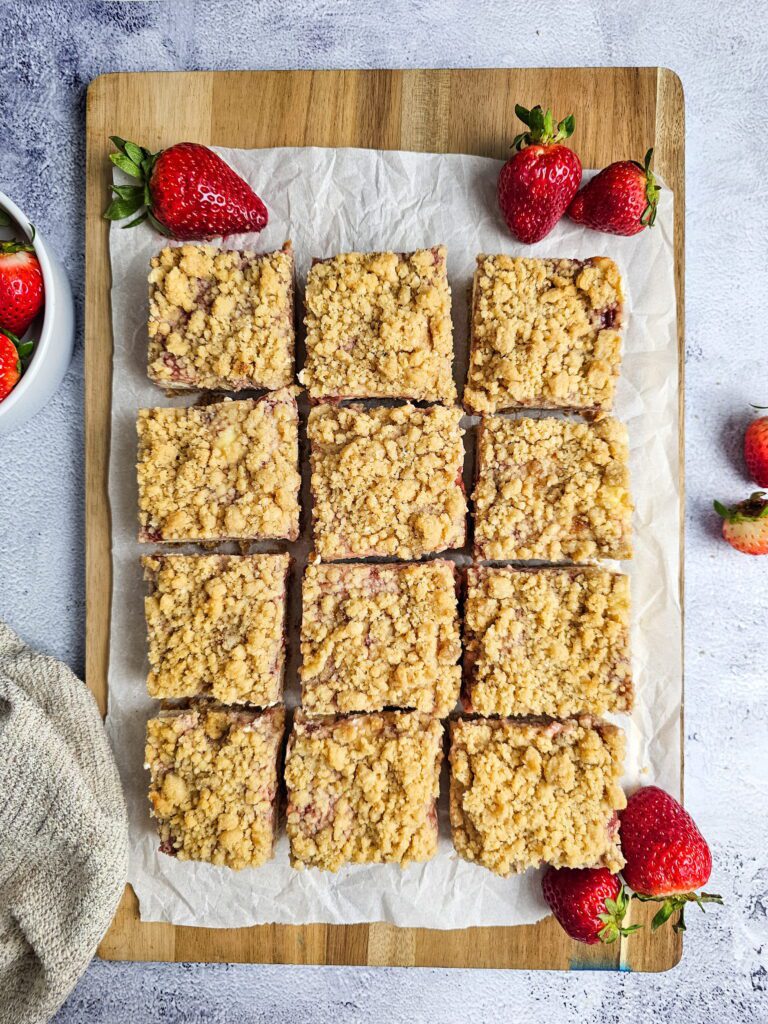 full pan of strawberry cheesecake bars ready to serve