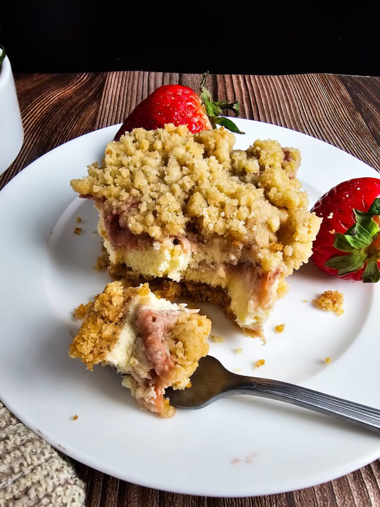 strawberry cheesecake bars served on dessert plate