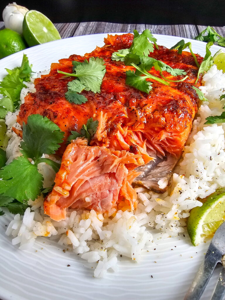 Leftover chili lime baked trout stored in a glass airtight container in the refrigerator for up to 2 days